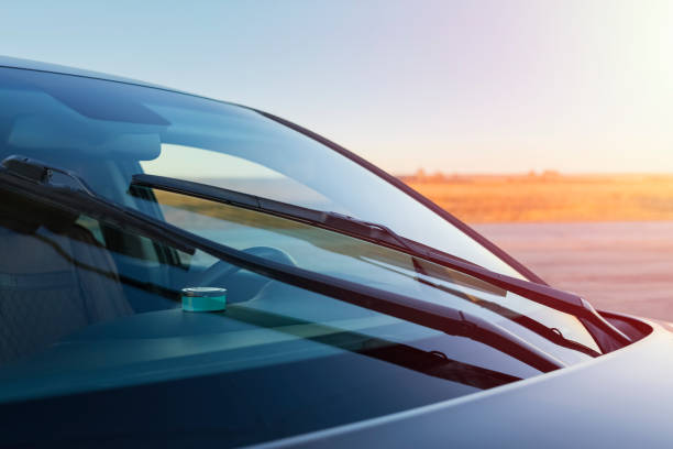 Clean windshield with sky reflection